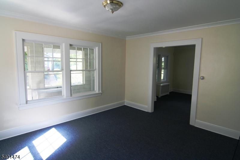 220 South Ridgewood Road South Orange, NJ 07079 - Photo 3 of 14 wooden floor in an empty room with a window