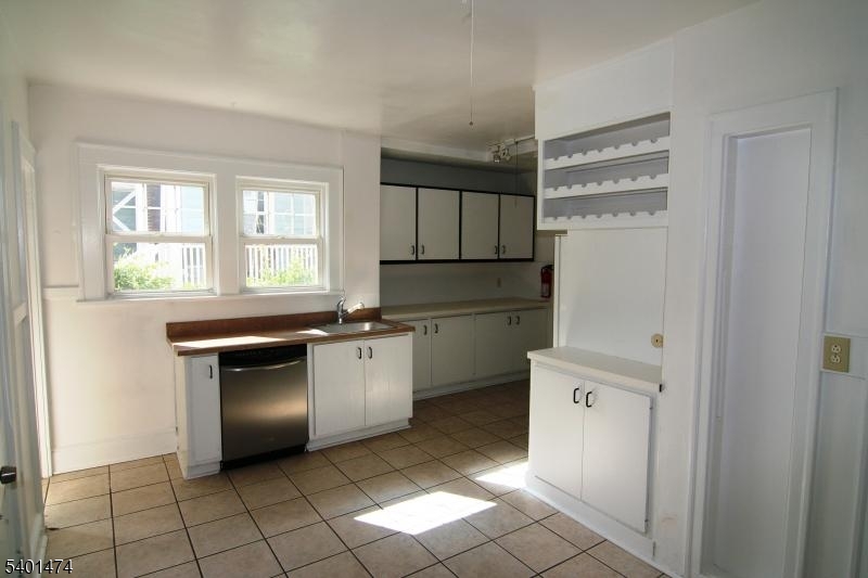 220 South Ridgewood Road South Orange, NJ 07079 - Photo 4 of 14 a kitchen with a cabinets and a refrigerator