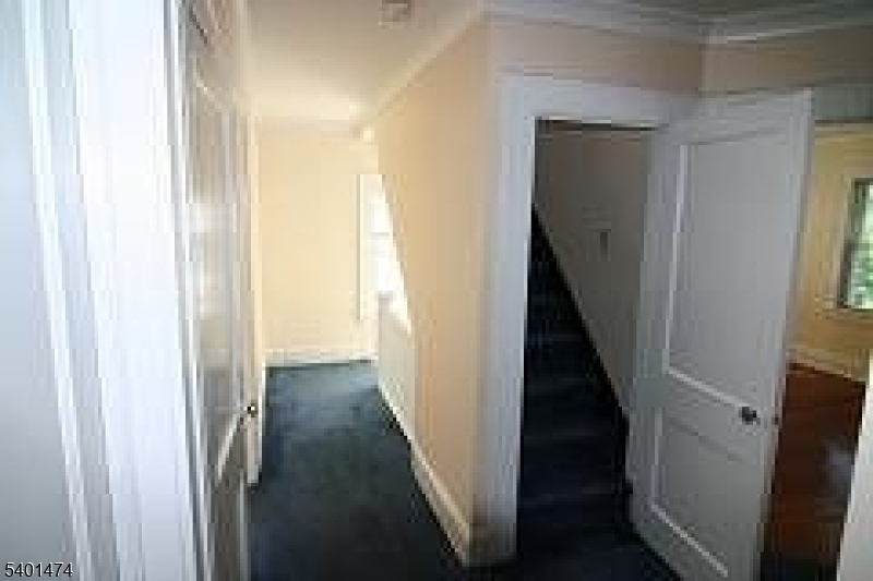 220 South Ridgewood Road South Orange, NJ 07079 - Photo 6 of 14 a view of a hallway with a wooden door