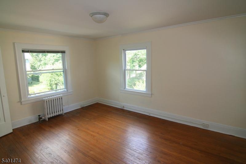 220 South Ridgewood Road South Orange, NJ 07079 - Photo 9 of 14 an empty room with wooden floor and windows