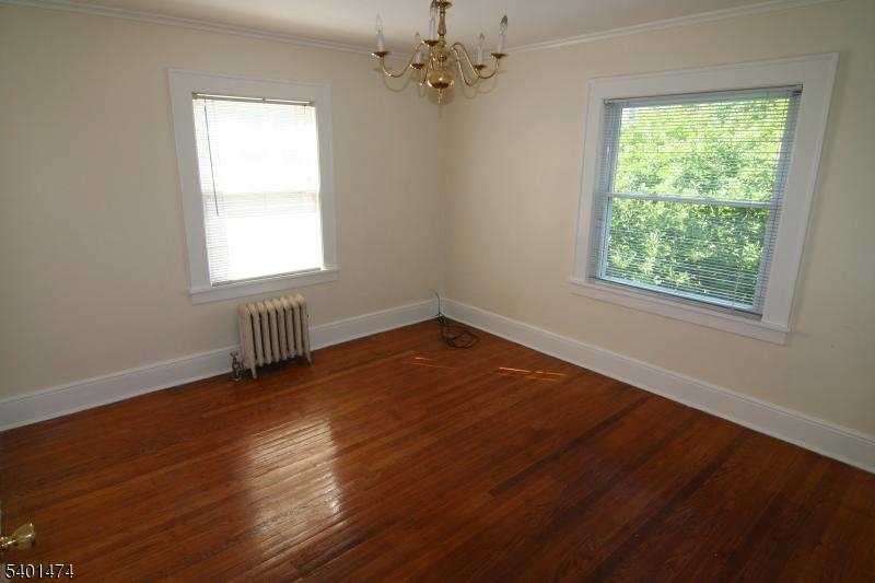 220 South Ridgewood Road South Orange, NJ 07079 - Photo 10 of 14 a view of an empty room with wooden floor and a window