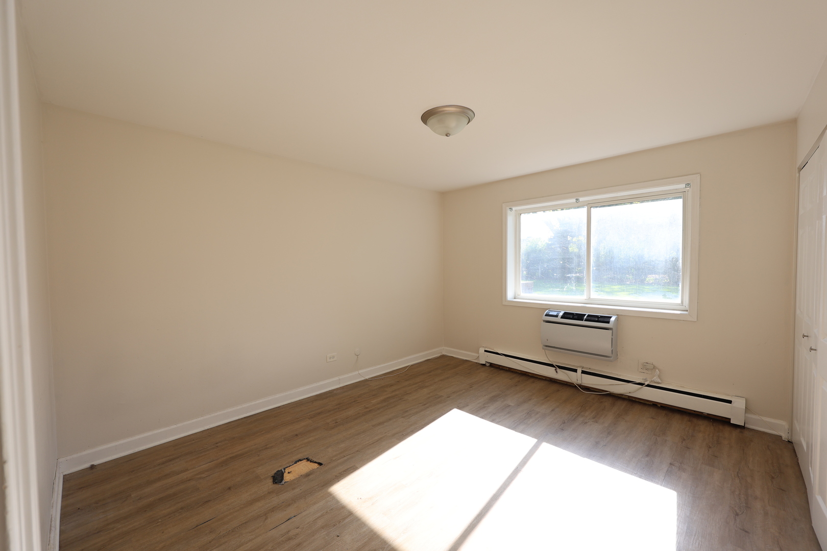 2230 South Goebbert Road, Unit 139 Arlington Heights, IL 60005 - Photo 12 of 14 an empty room with a window