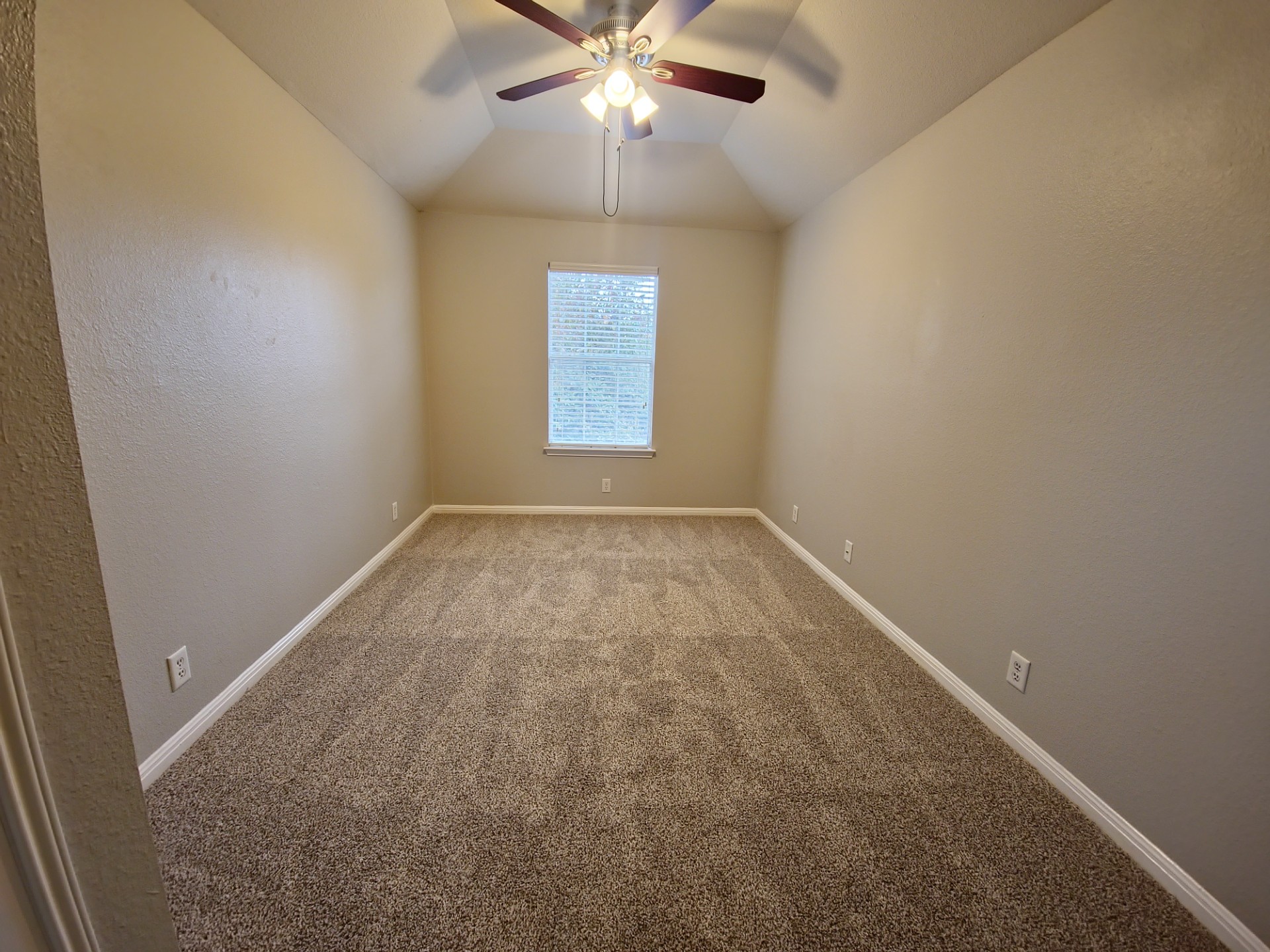 107 Orange Tree Lane Georgetown, TX 78626 - Photo 13 of 16 A versatile room with carpeting and a ceiling fan, ready for personal touches.