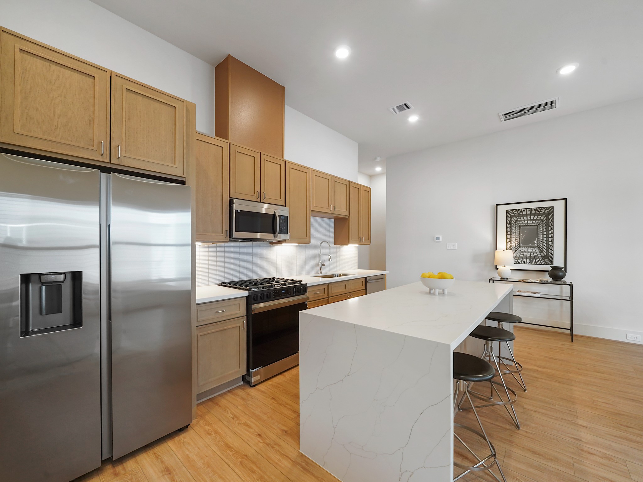 861 Rachel Street, Unit E Houston, TX 77091 - Photo 7 of 29 This stunning space boasts high ceilings and seamless transitions, offering an open, airy feel perfect for modern living.