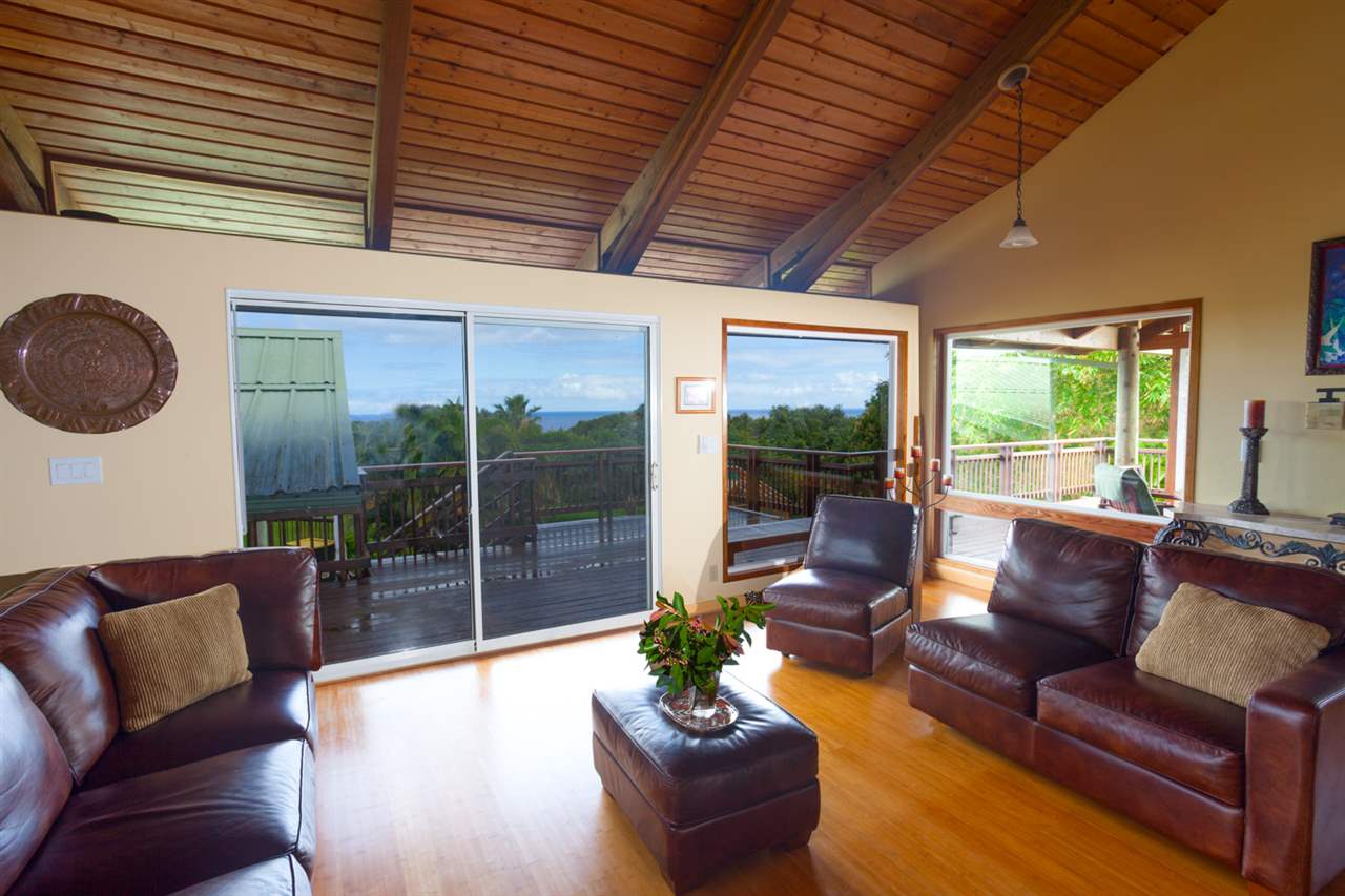 480 Hoolawa Road Haiku, HI 96708 - Photo 14 of 30 a living room with furniture and a large window