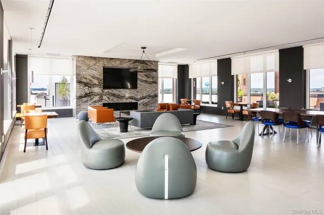 a living room with furniture flat screen tv and a fireplace