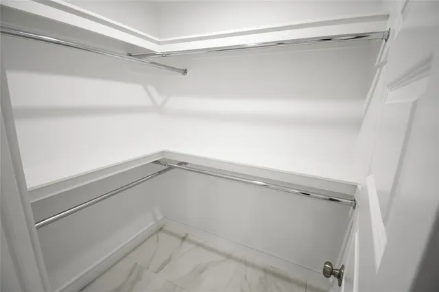 a view of an empty walk in closet