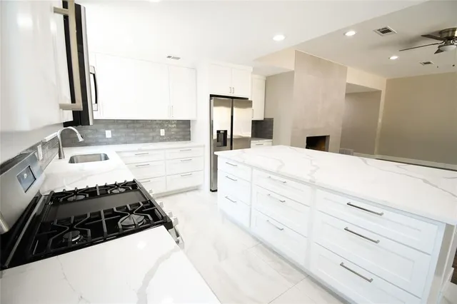 a kitchen with sink and stove
