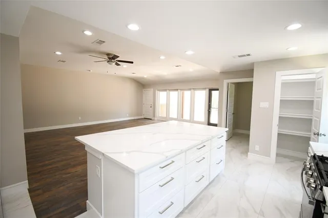 a bathroom with a sink a vanity and a shower