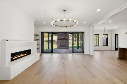 a kitchen with stainless steel appliances a sink stove and cabinets