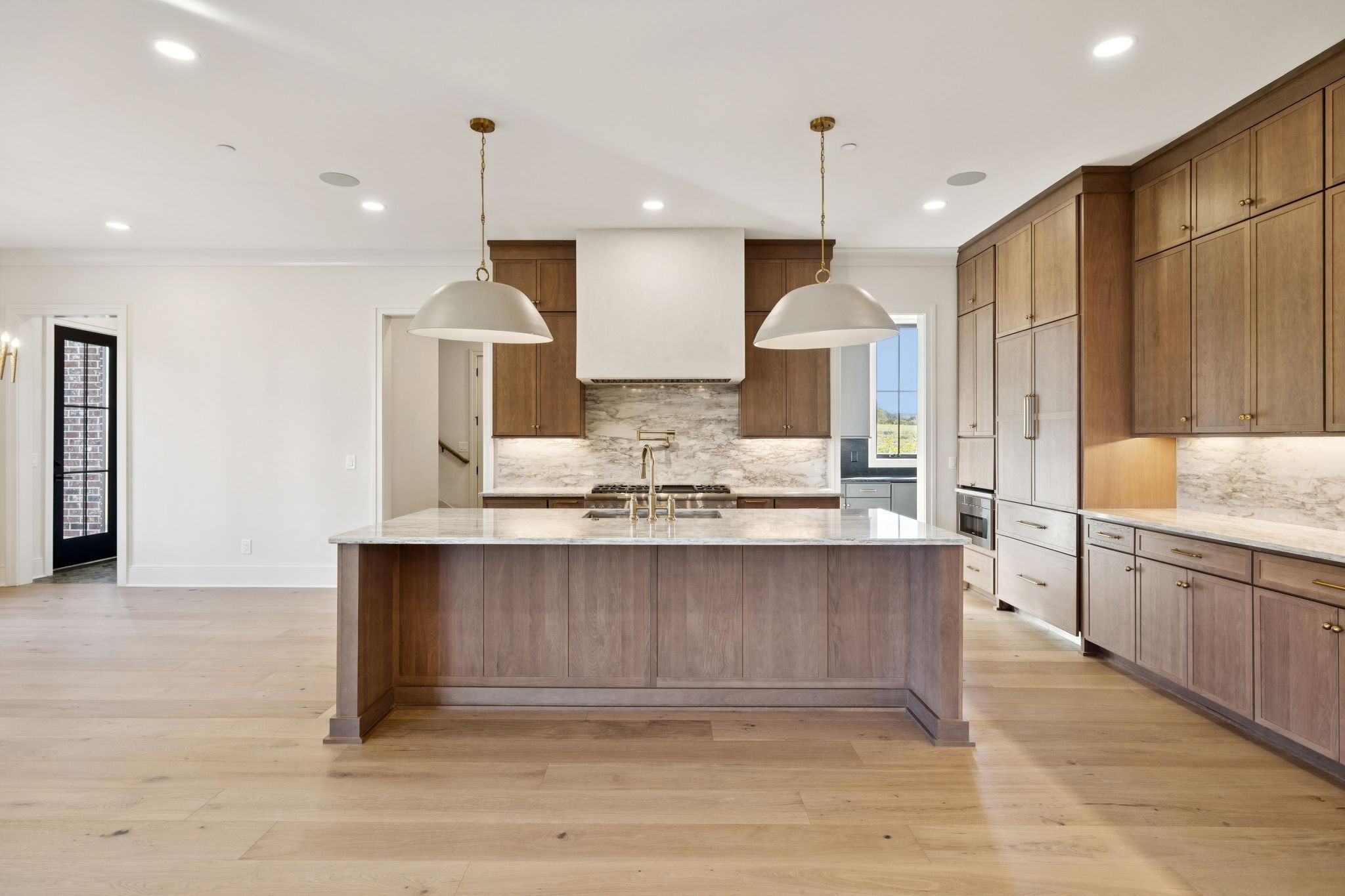 9204 Horton Highway College Grove, TN 37046 - Photo 15 of 87 a large kitchen with granite countertop a large counter top a sink stainless steel appliances and cabinets