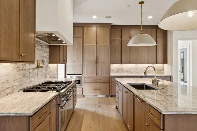 a large white room with mirror and a sink