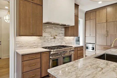 a spacious bathroom with a tub sink and mirror