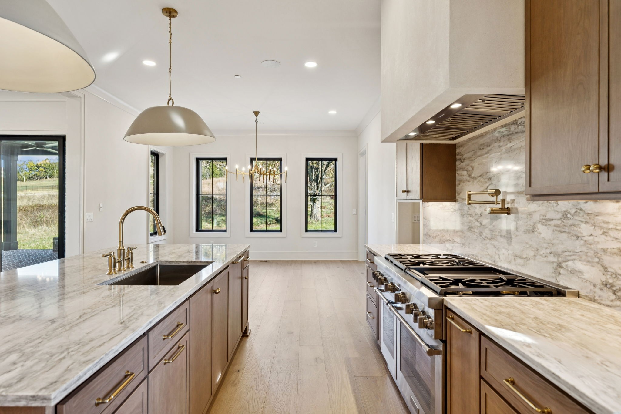 9204 Horton Highway College Grove, TN 37046 - Photo 21 of 87 a kitchen that has a sink stainless steel appliances a counter space and a window