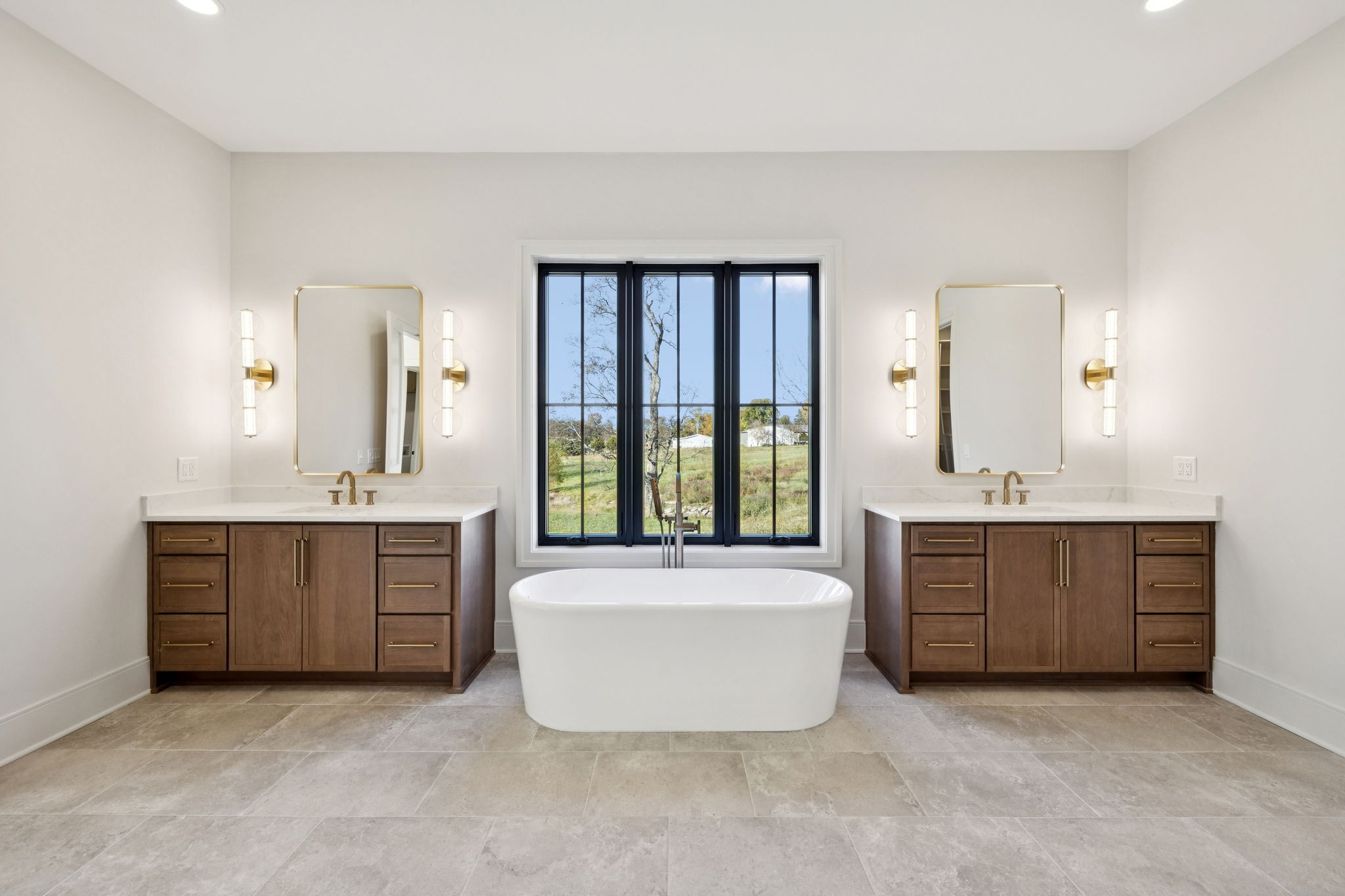 9204 Horton Highway College Grove, TN 37046 - Photo 35 of 87 a spacious bathroom with a tub sink and mirror