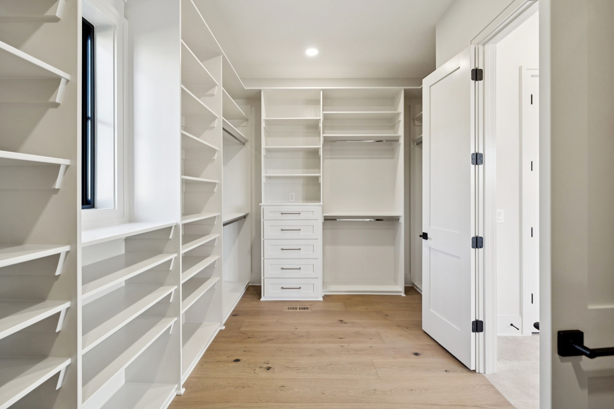 9204 Horton Highway College Grove, TN 37046 - Photo 41 of 87 a view of walk in closet with empty racks