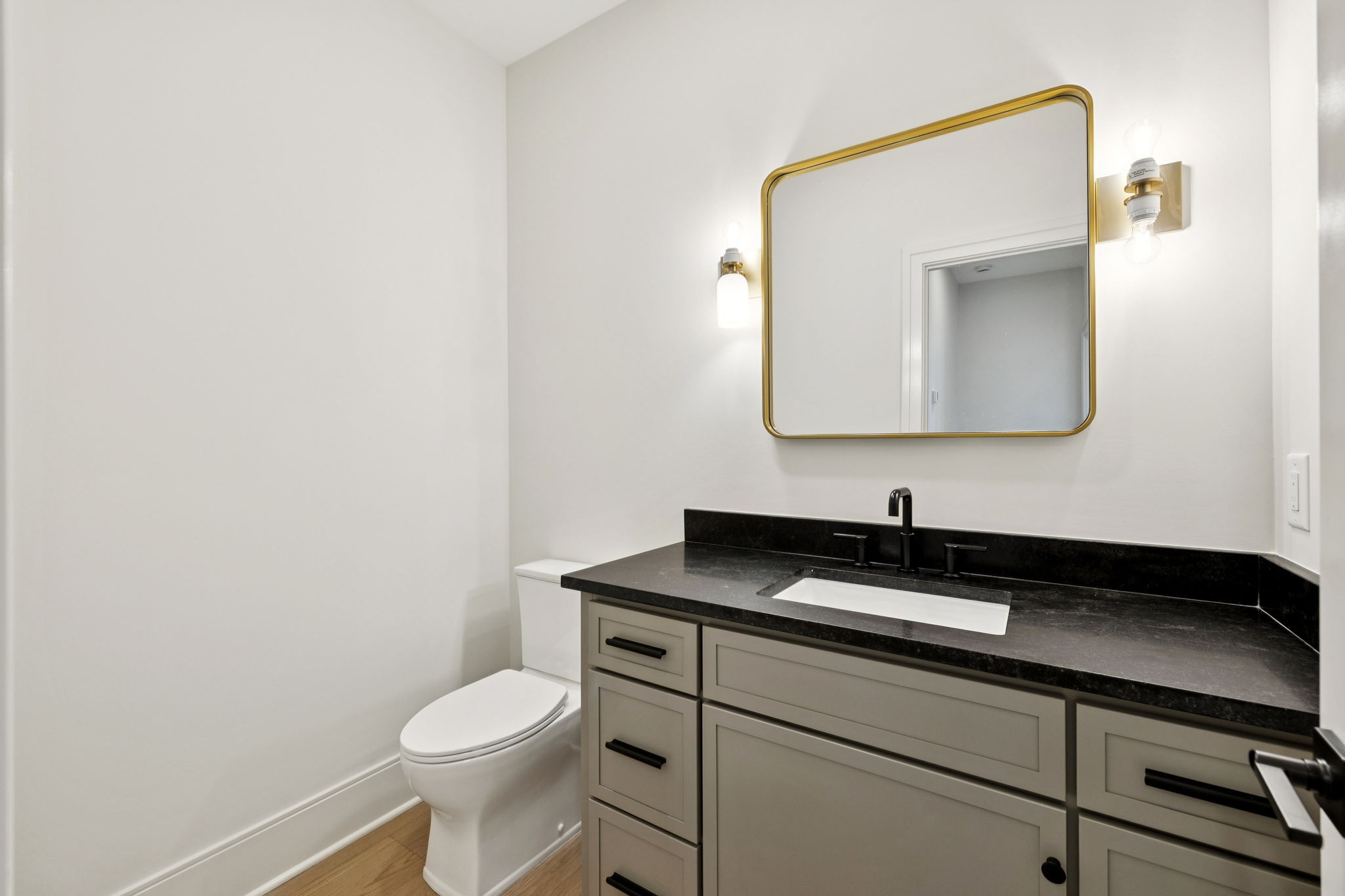 9204 Horton Highway College Grove, TN 37046 - Photo 53 of 87 a bathroom with a toilet sink and mirror