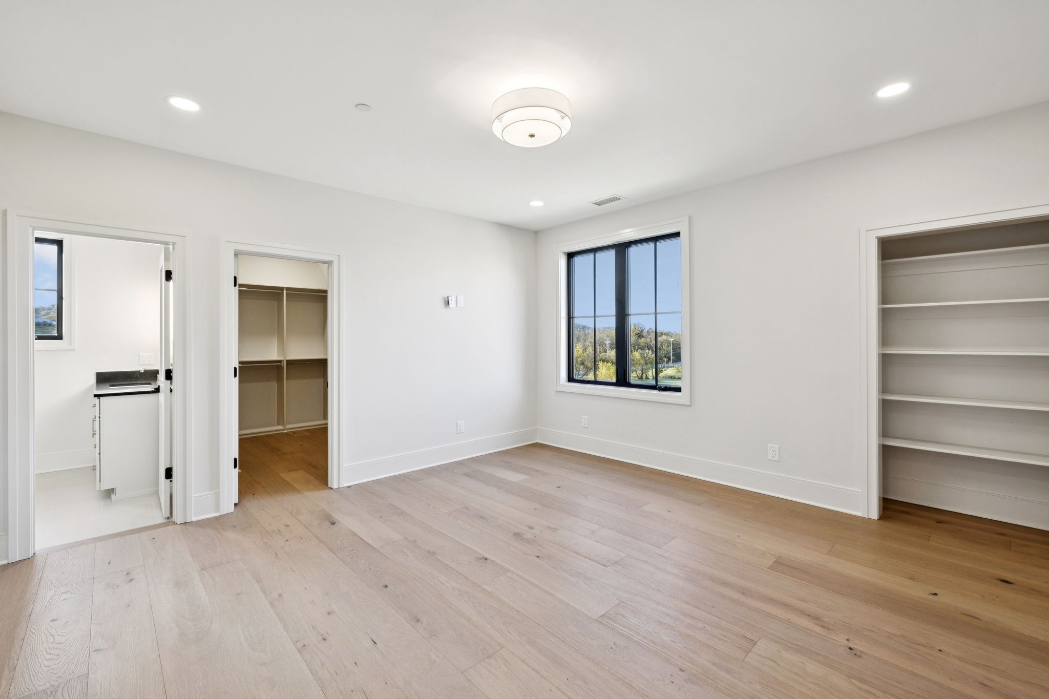 9204 Horton Highway College Grove, TN 37046 - Photo 54 of 87 a view of an empty room with a window and wooden floor
