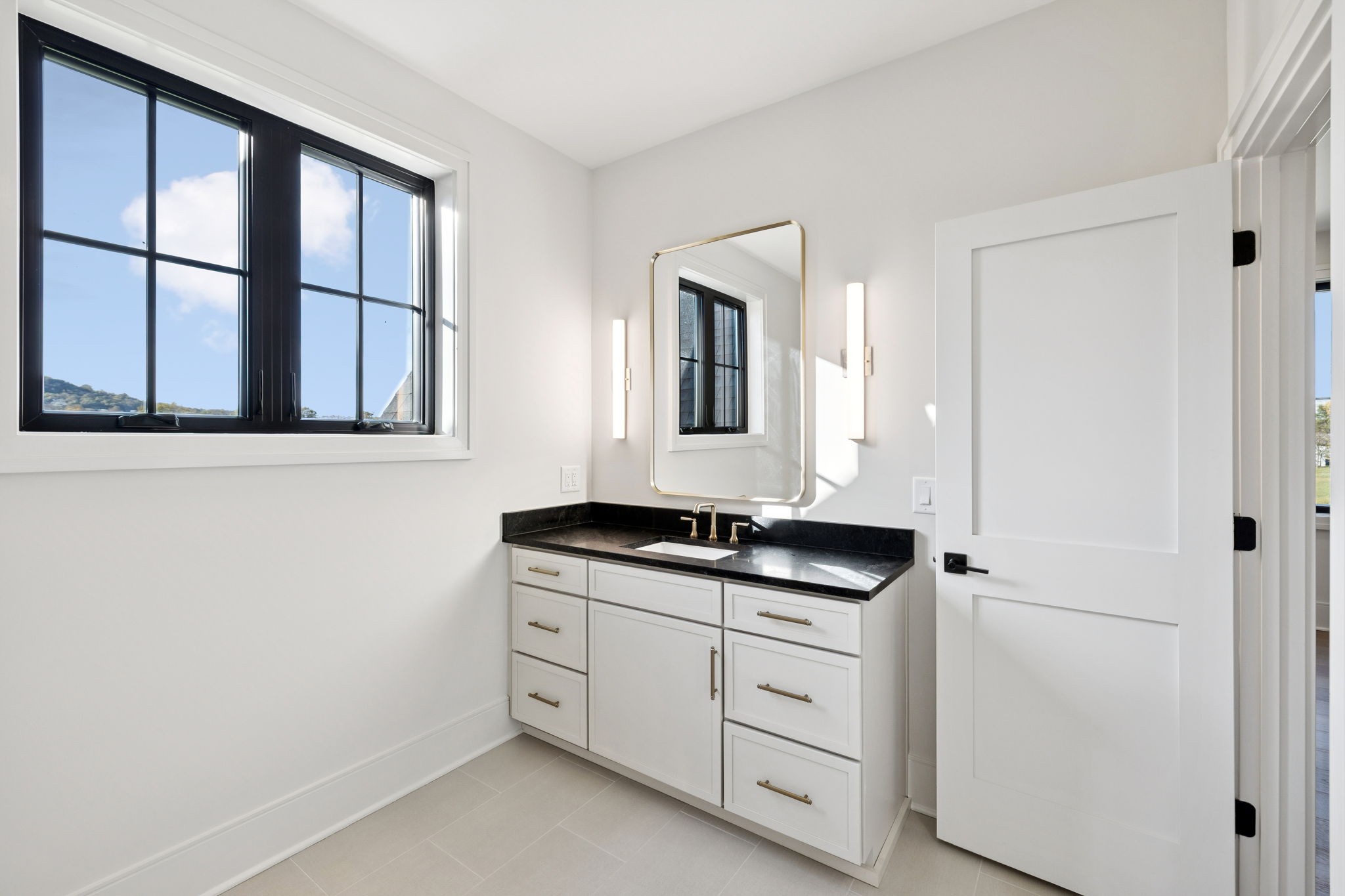 9204 Horton Highway College Grove, TN 37046 - Photo 57 of 87 a bathroom with a granite countertop sink and a mirror