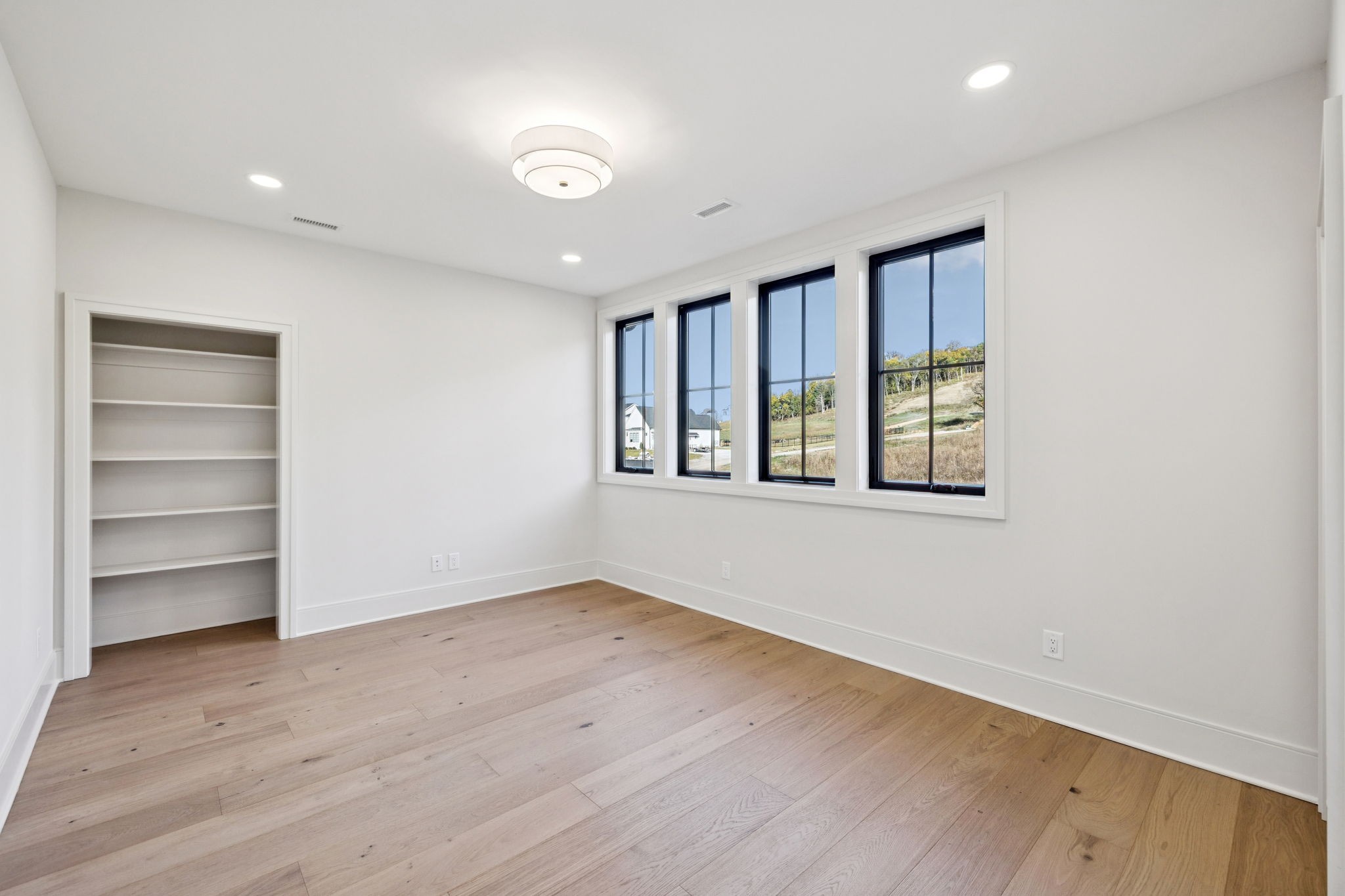 9204 Horton Highway College Grove, TN 37046 - Photo 59 of 87 a view of an empty room with a window and wooden floor
