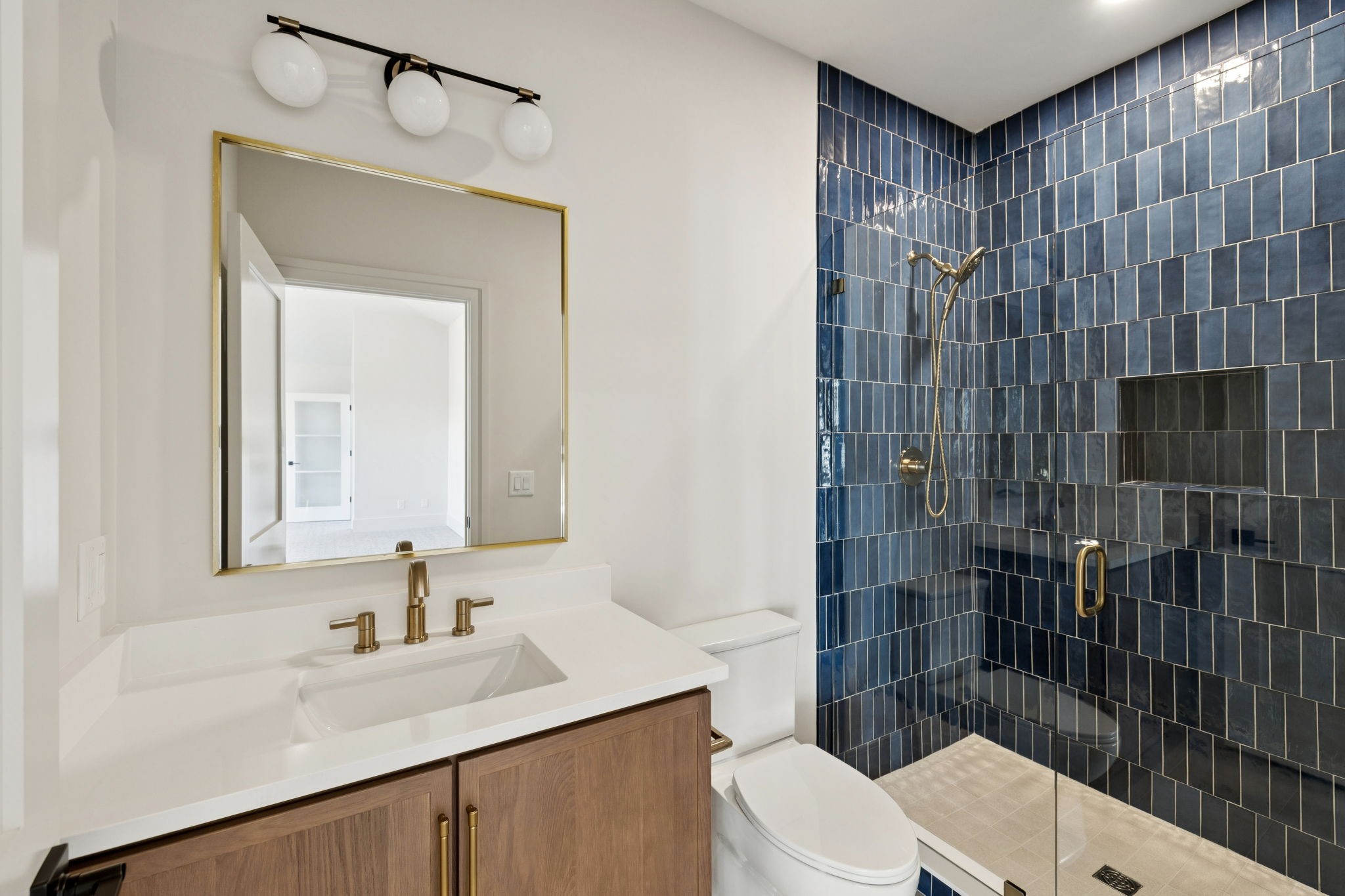 9204 Horton Highway College Grove, TN 37046 - Photo 68 of 87 a bathroom with a sink toilet vanity and shower