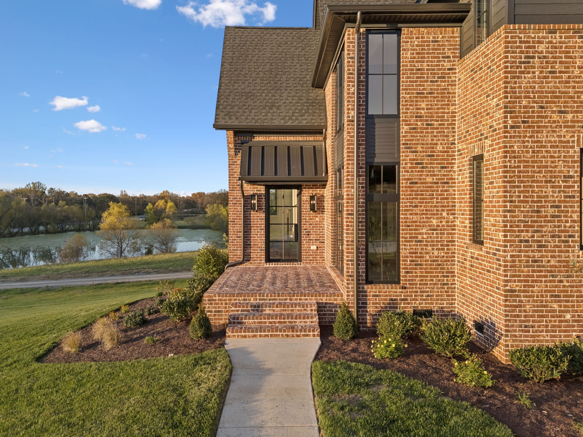 9204 Horton Highway College Grove, TN 37046 - Photo 7 of 87 a front view of a house with lake view