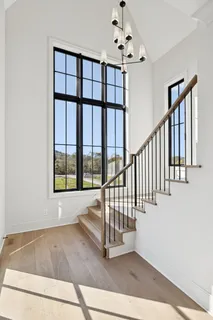 a kitchen that has a sink stainless steel appliances a counter space and a window