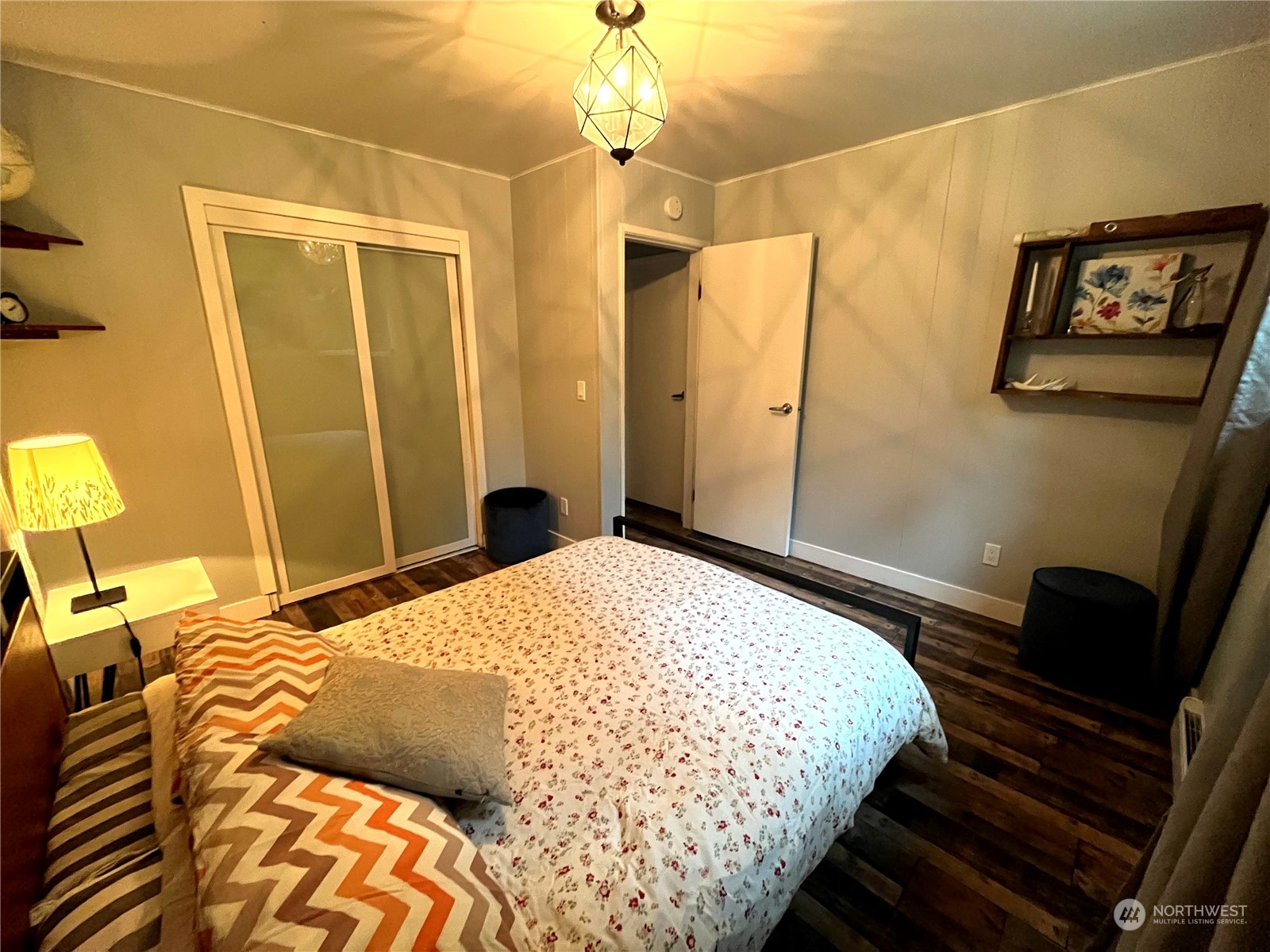 68 Regina Way Point Roberts, WA 98281 - Photo 11 of 24 a bedroom with a bed and a chandelier