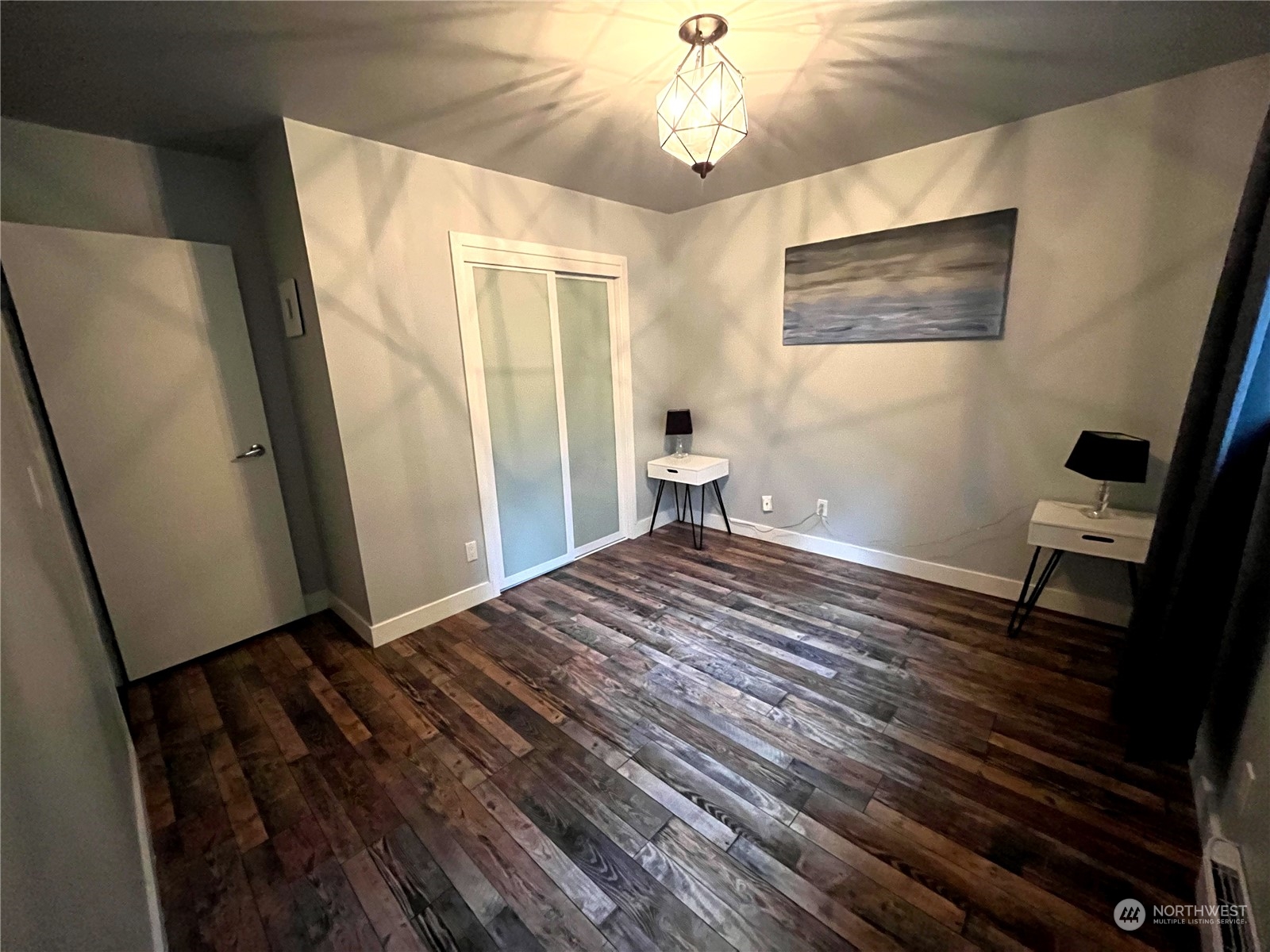 68 Regina Way Point Roberts, WA 98281 - Photo 14 of 24 a bedroom with a bed and wooden floor