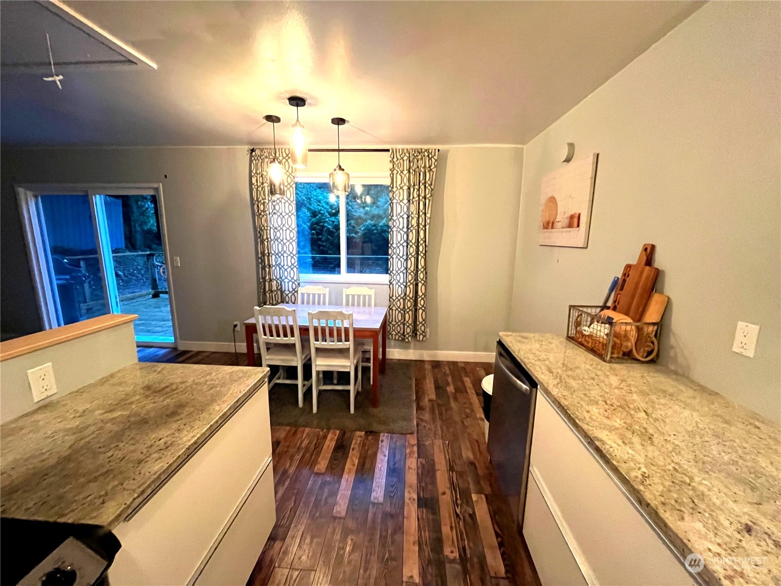 68 Regina Way Point Roberts, WA 98281 - Photo 7 of 24 a dining room with stainless steel appliances granite countertop furniture and wooden floor