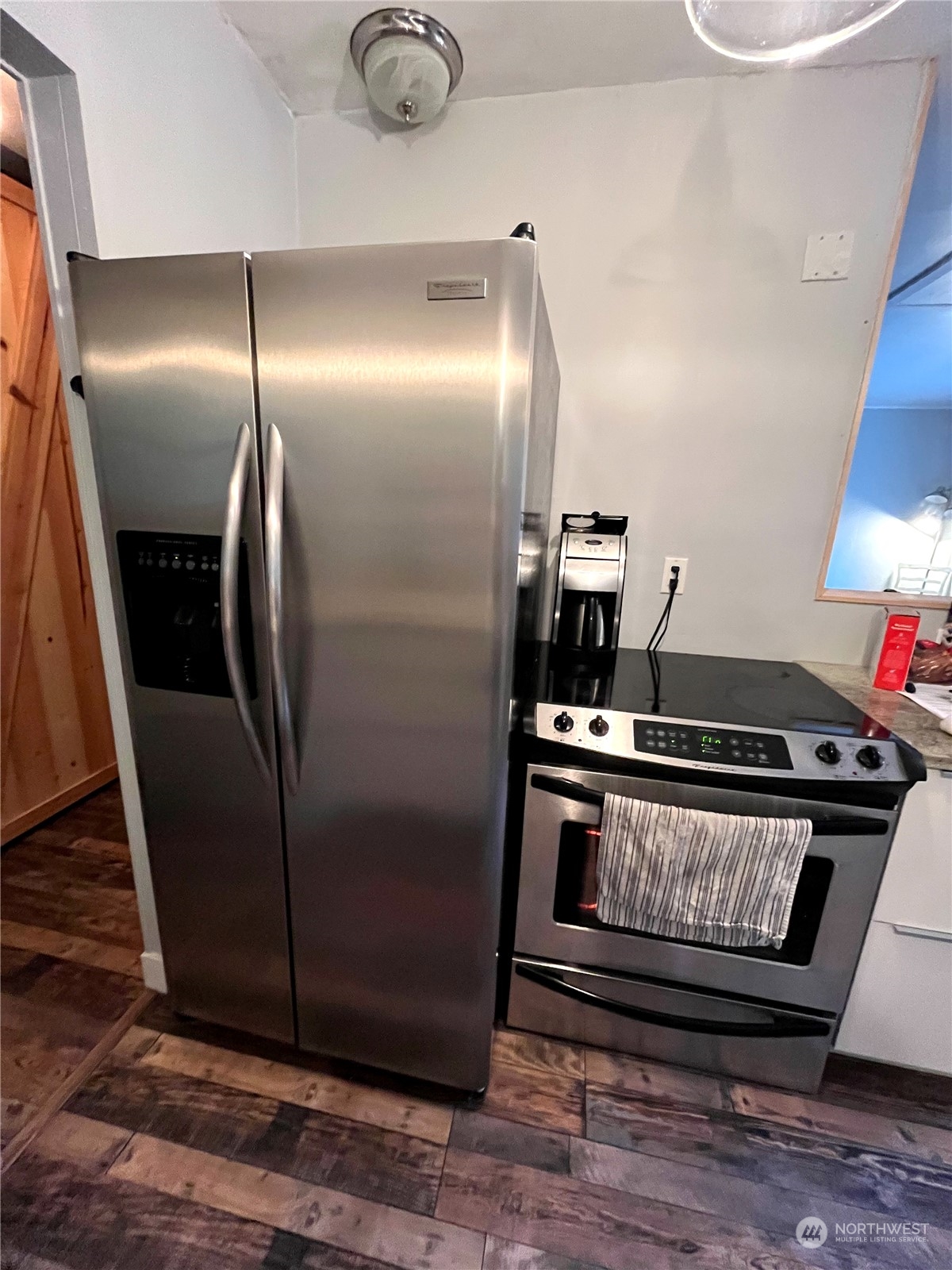68 Regina Way Point Roberts, WA 98281 - Photo 10 of 24 a metallic refrigerator freezer sitting inside of a kitchen