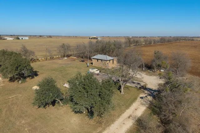 a kitchen with stainless steel appliances granite countertop a refrigerator and a stove