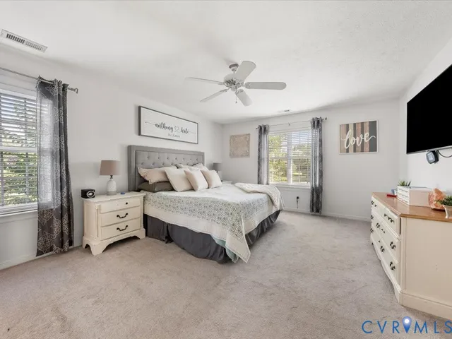 a bathroom with a tub sink shower and mirror