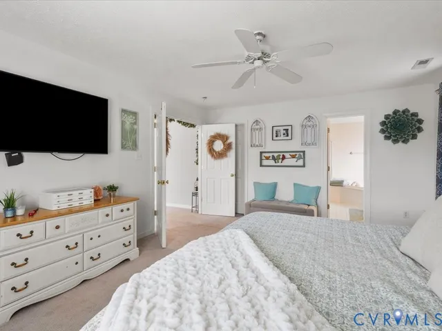 a spacious bathroom with a double vanity sink a mirror and a bathtub