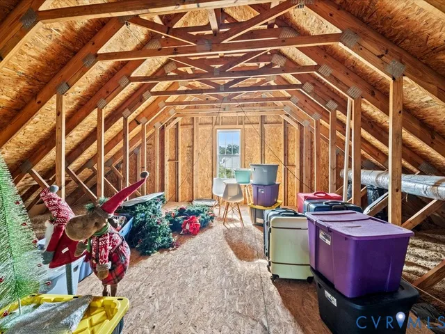 a balcony with table and chairs