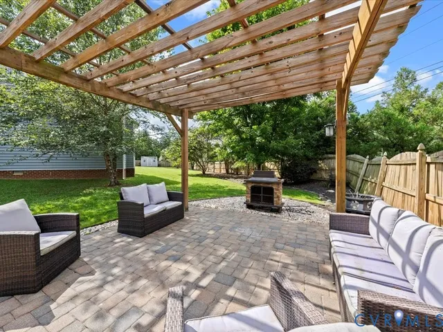 an aerial view of a house with swimming pool and garden