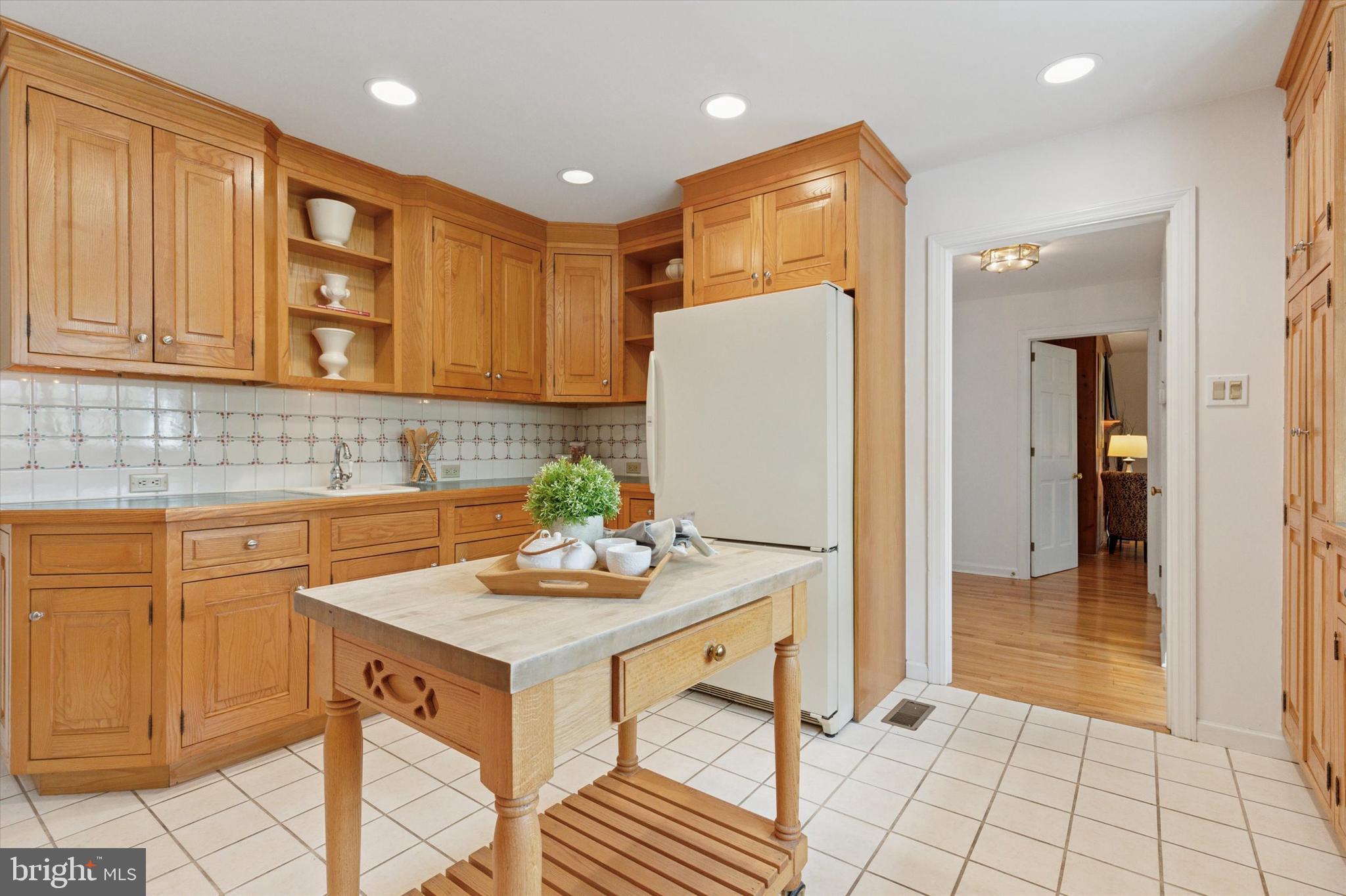 99 Elfman Drive Doylestown, PA 18901 - Photo 15 of 35 a kitchen with stainless steel appliances granite countertop a refrigerator and a stove top oven