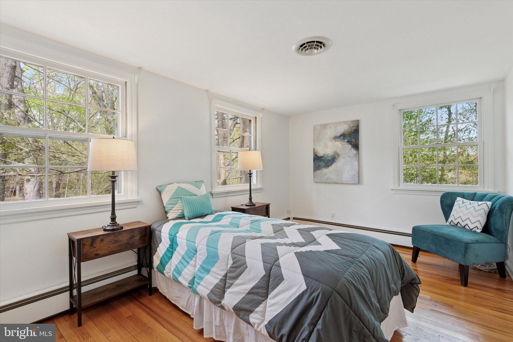 99 Elfman Drive Doylestown, PA 18901 - Photo 24 of 35 a bedroom with a bed and wooden floor