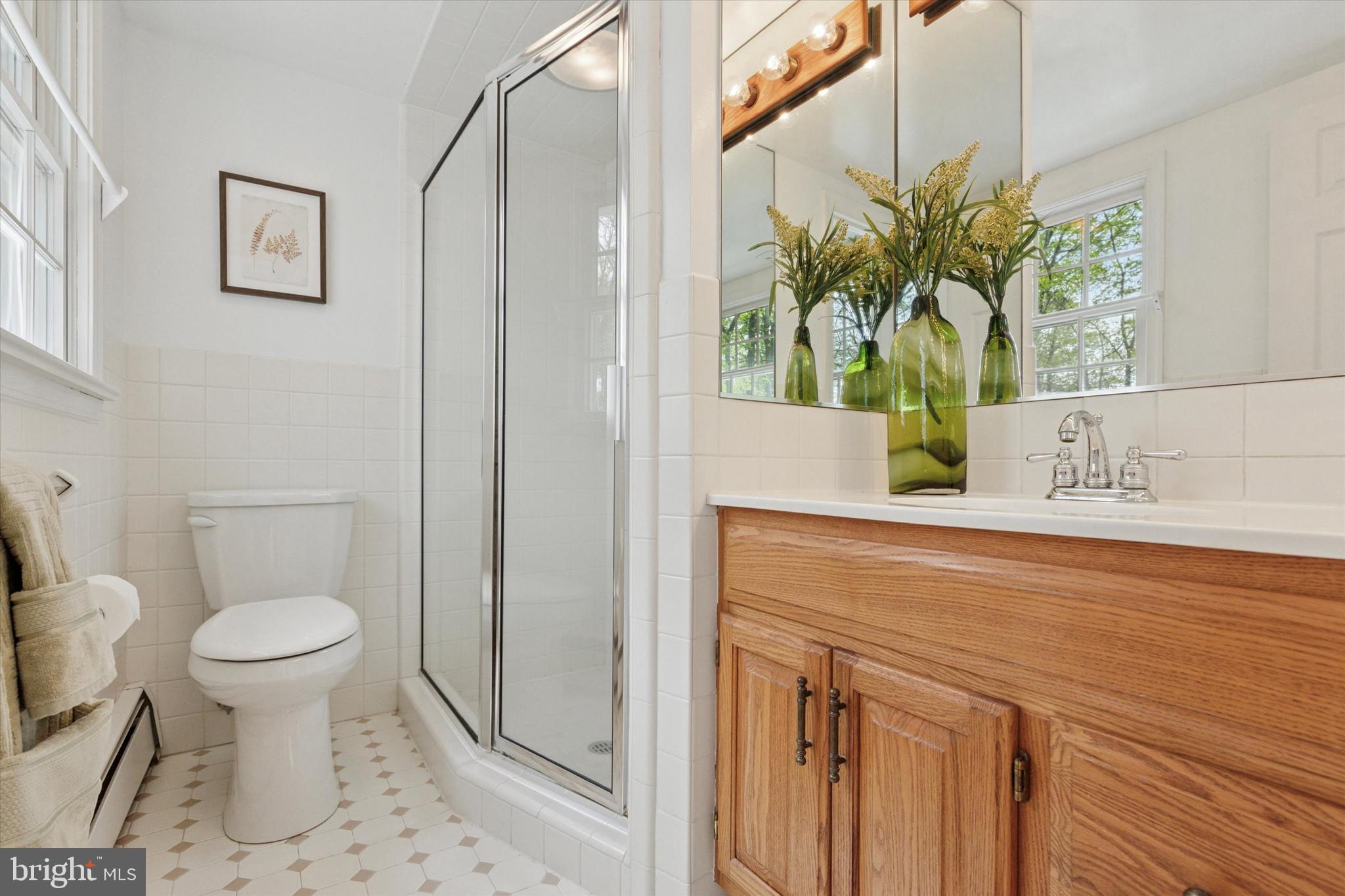 99 Elfman Drive Doylestown, PA 18901 - Photo 25 of 35 a bathroom with a sink and a mirror