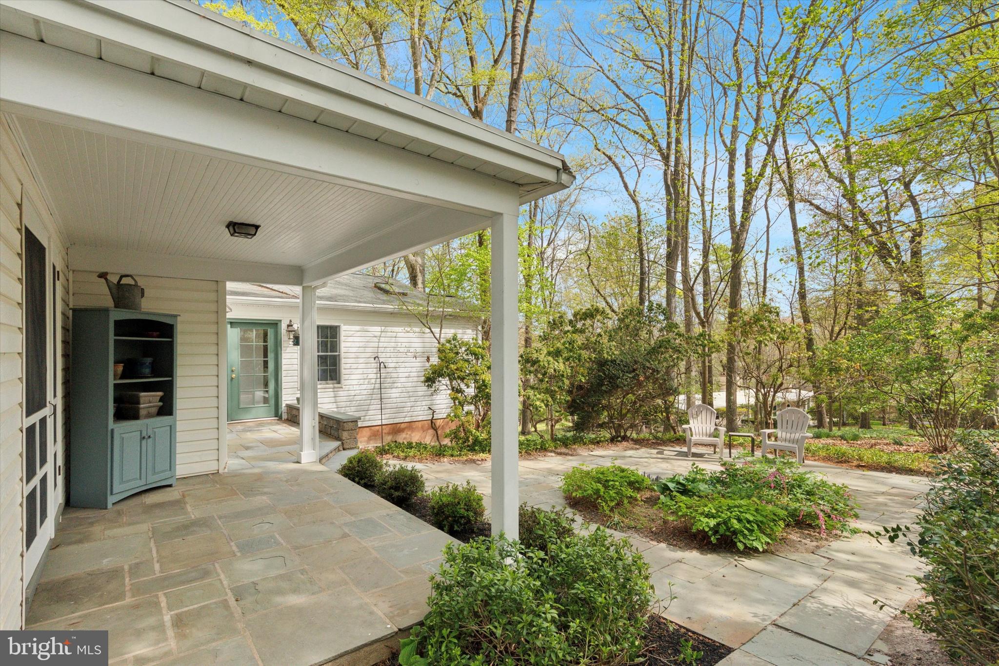 99 Elfman Drive Doylestown, PA 18901 - Photo 4 of 35 a view of a patio with table and chairs and potted plants