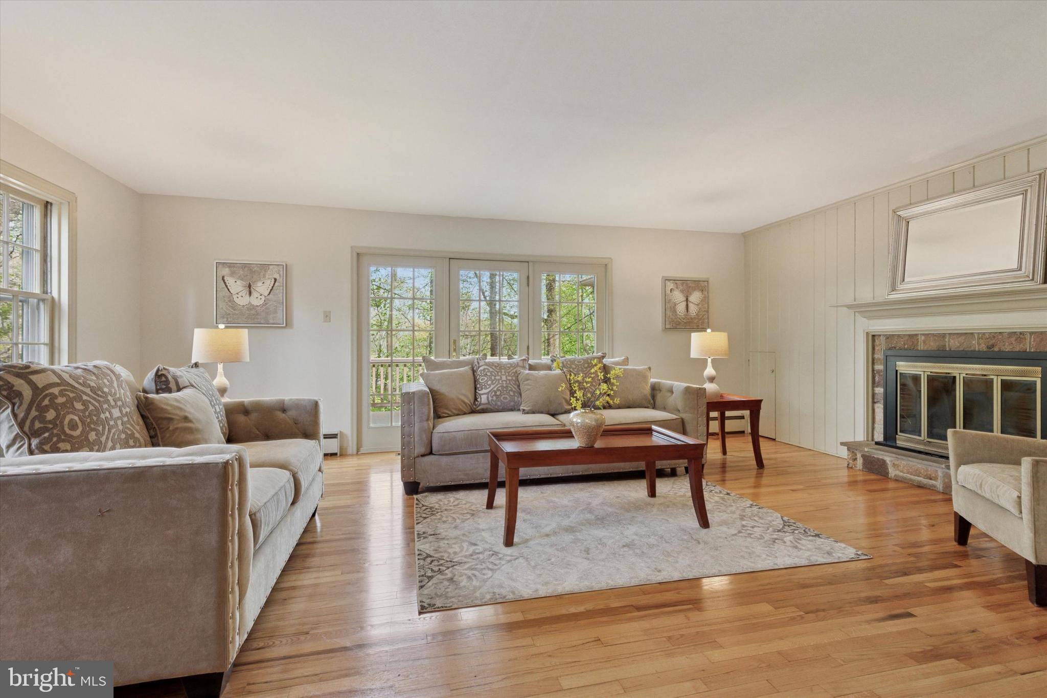 99 Elfman Drive Doylestown, PA 18901 - Photo 6 of 35 a living room with furniture and a fireplace