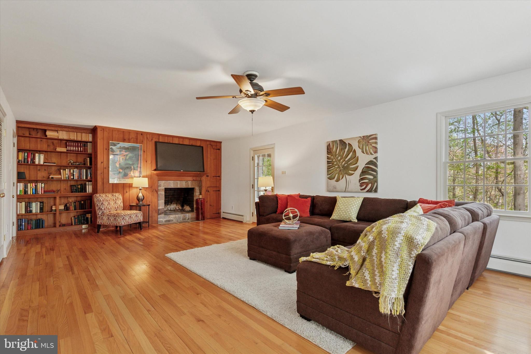 99 Elfman Drive Doylestown, PA 18901 - Photo 8 of 35 a living room with fireplace furniture and a large window