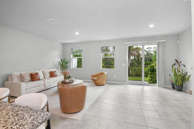 a living room with furniture and window