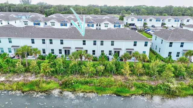 a aerial view of a house with a yard and plants