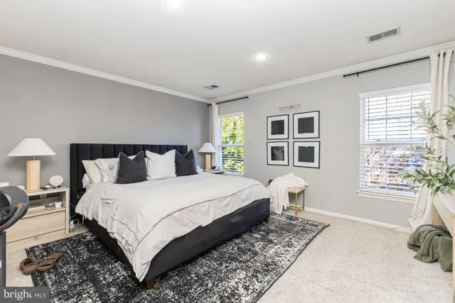 a bedroom with bed and a window