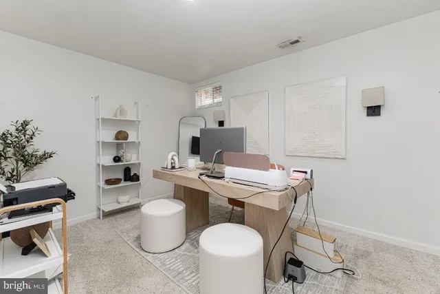 a room with a chair and tables