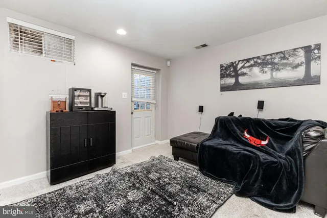 a bedroom with a bed and cabinets