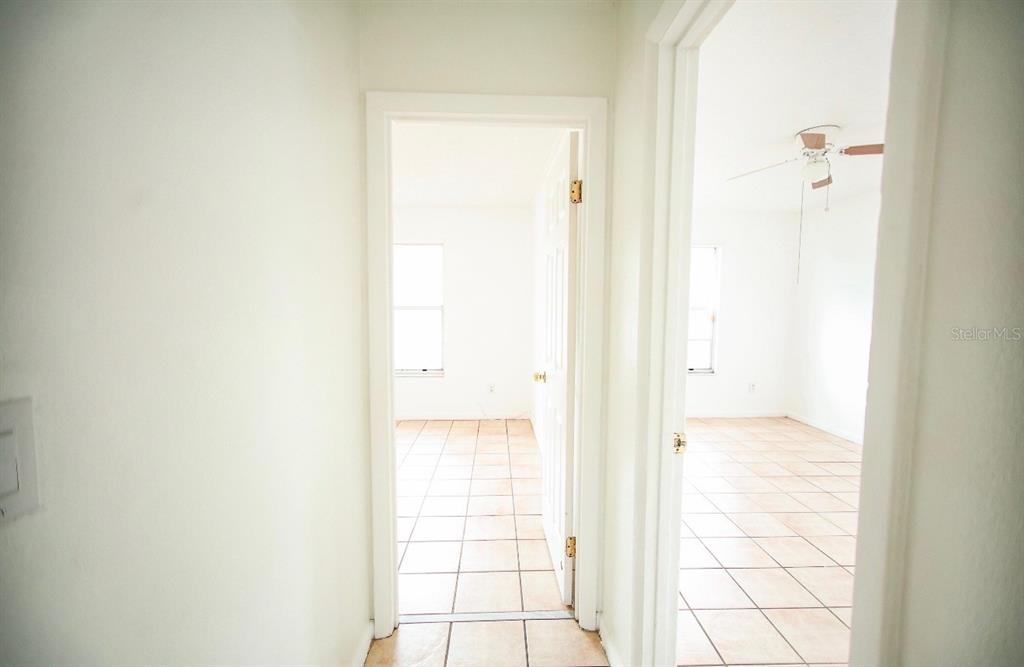 606 Water Road Ocala, FL 34472 - Photo 21 of 34 a bathroom with a glass shower door