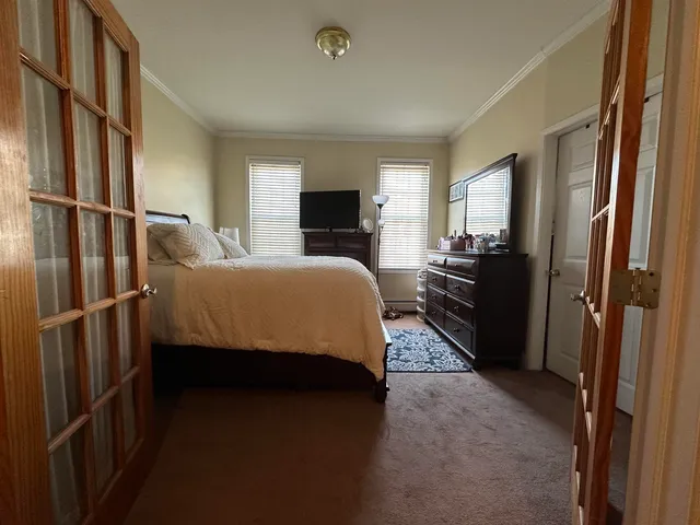 a kitchen with stainless steel appliances kitchen island granite countertop a refrigerator and microwave