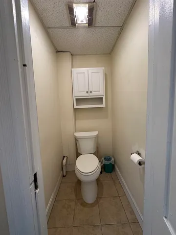 a hotel room with a bed a couch and dresser